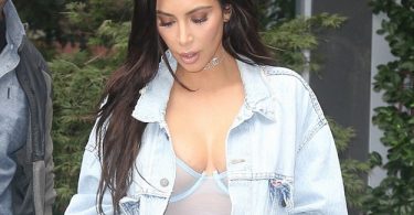 Kim Kardashian again wears no bra with racy sheer dress