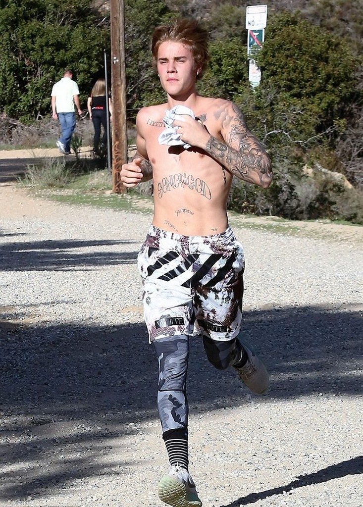 Justin Bieber figure in topless run