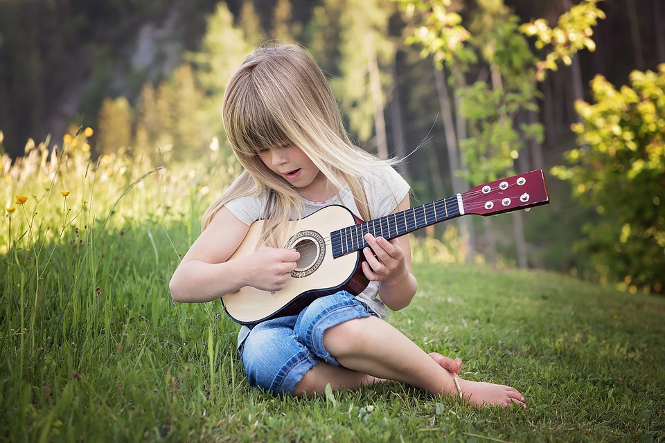 How does the guitar inspire the love of music in every child?