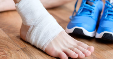 How does a physical therapist help to treat sports injuries