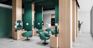 A salon with many seating options. The space is quite open and the color scheme uses a lot of green.