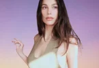 Camila Morrone wearing olive green dress on Instagram